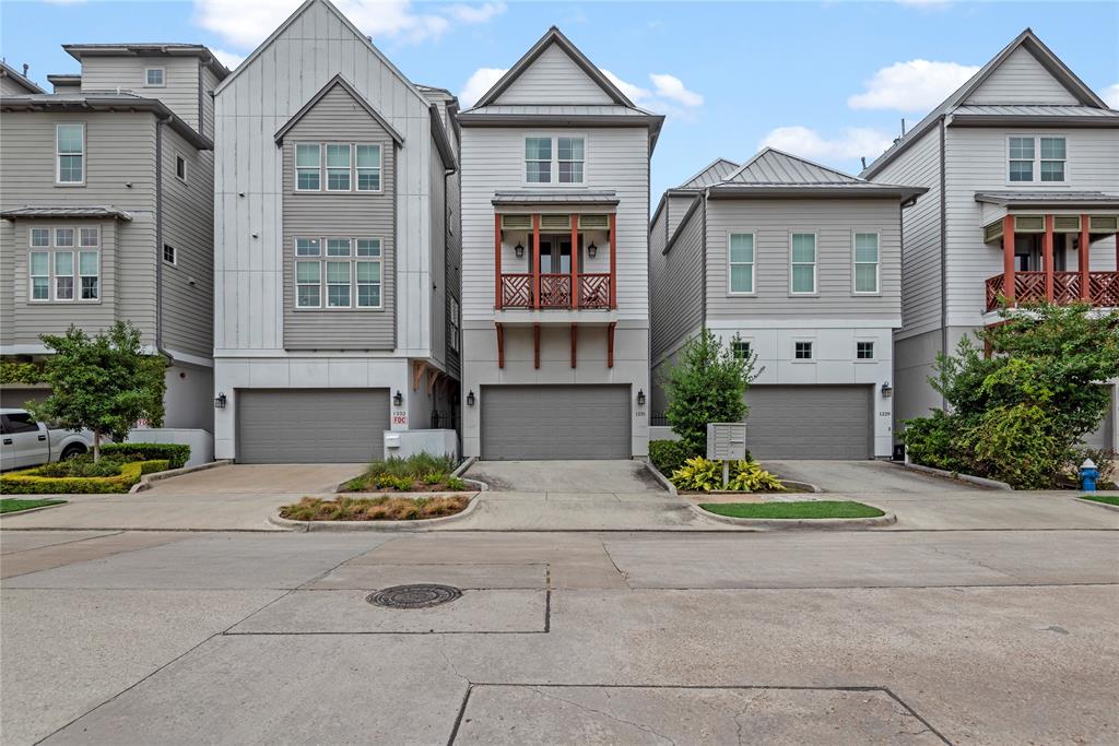 a front view of a residential houses with yard