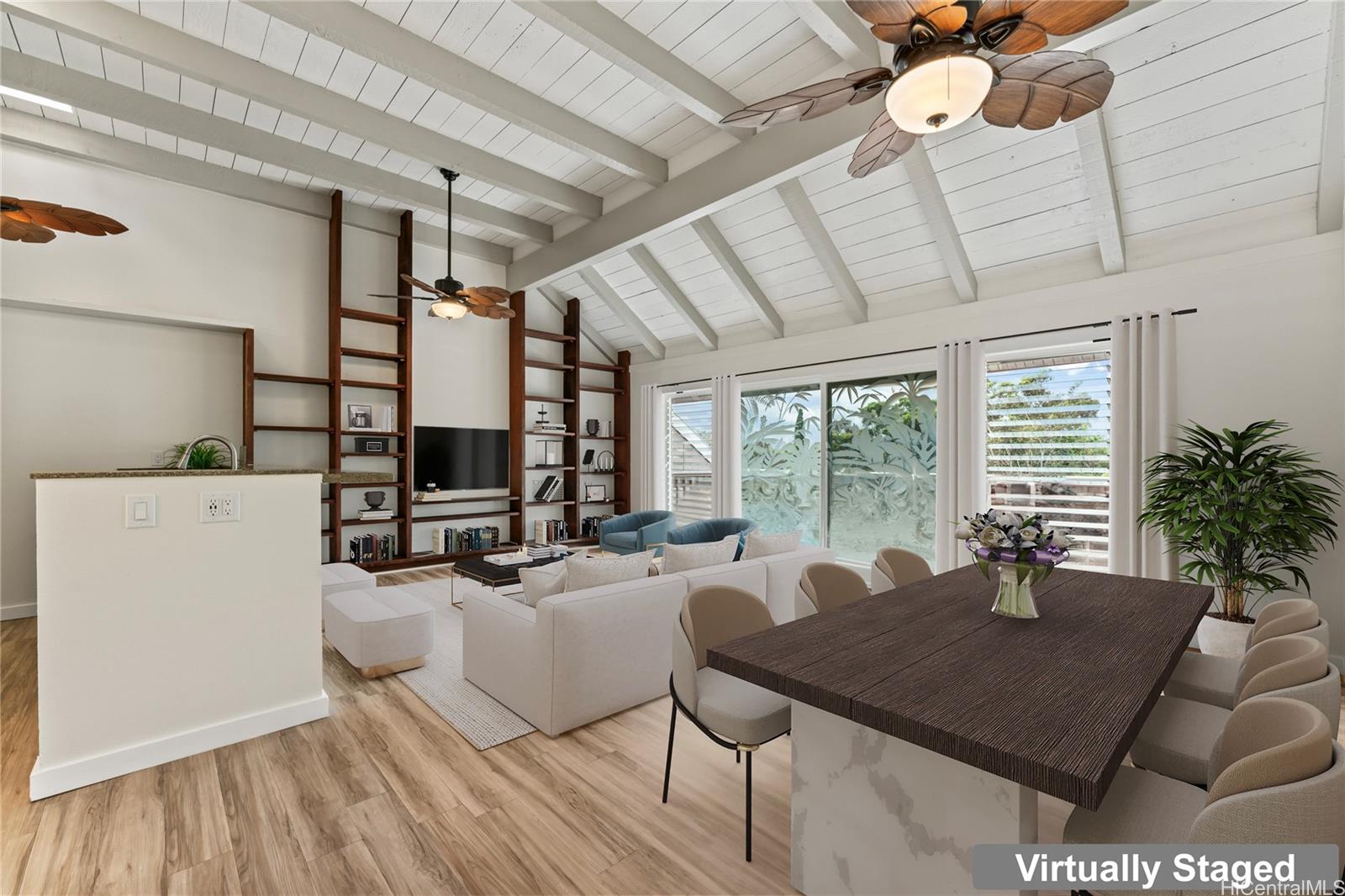 a living room with furniture a flat screen tv and a large window