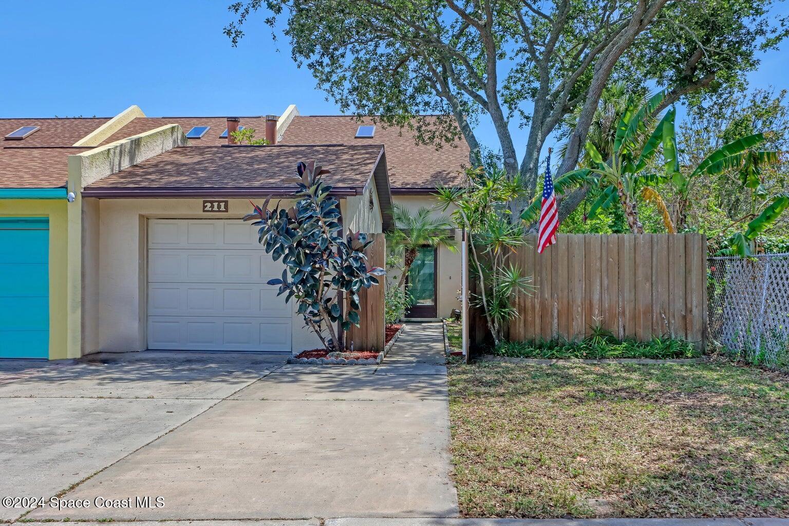 a front view of house with a yard