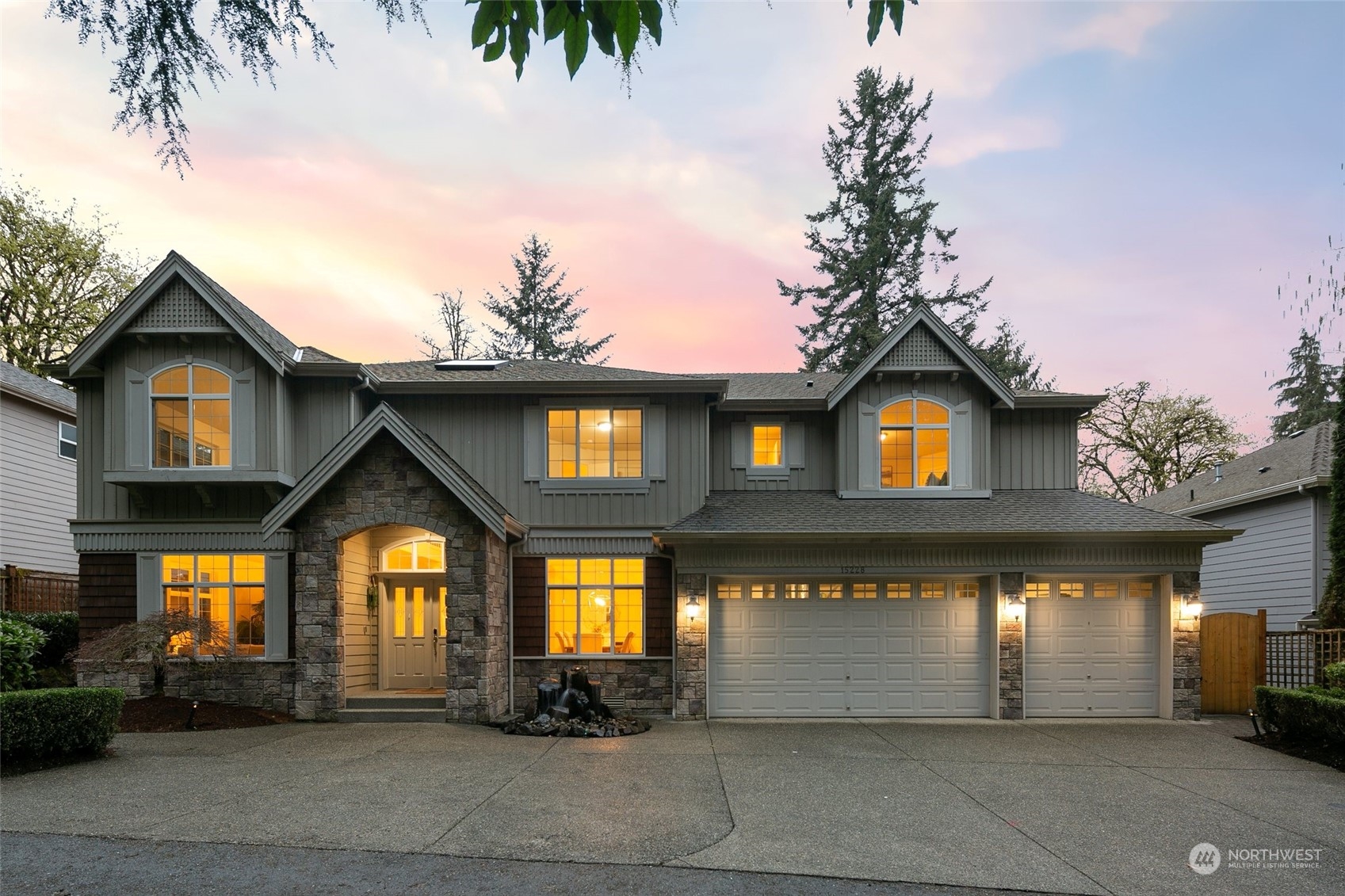 a front view of a house with a garage