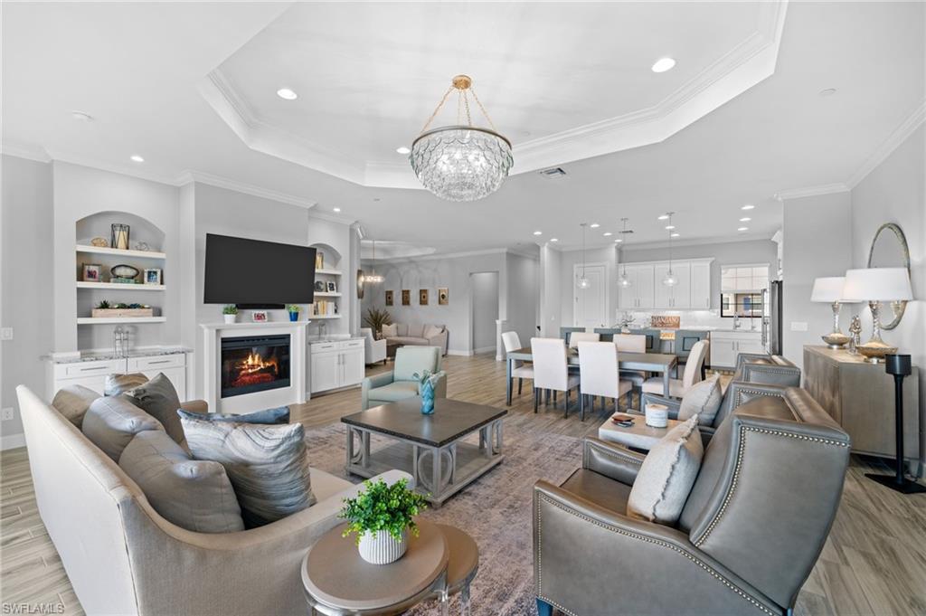 a living room with fireplace furniture and a flat screen tv