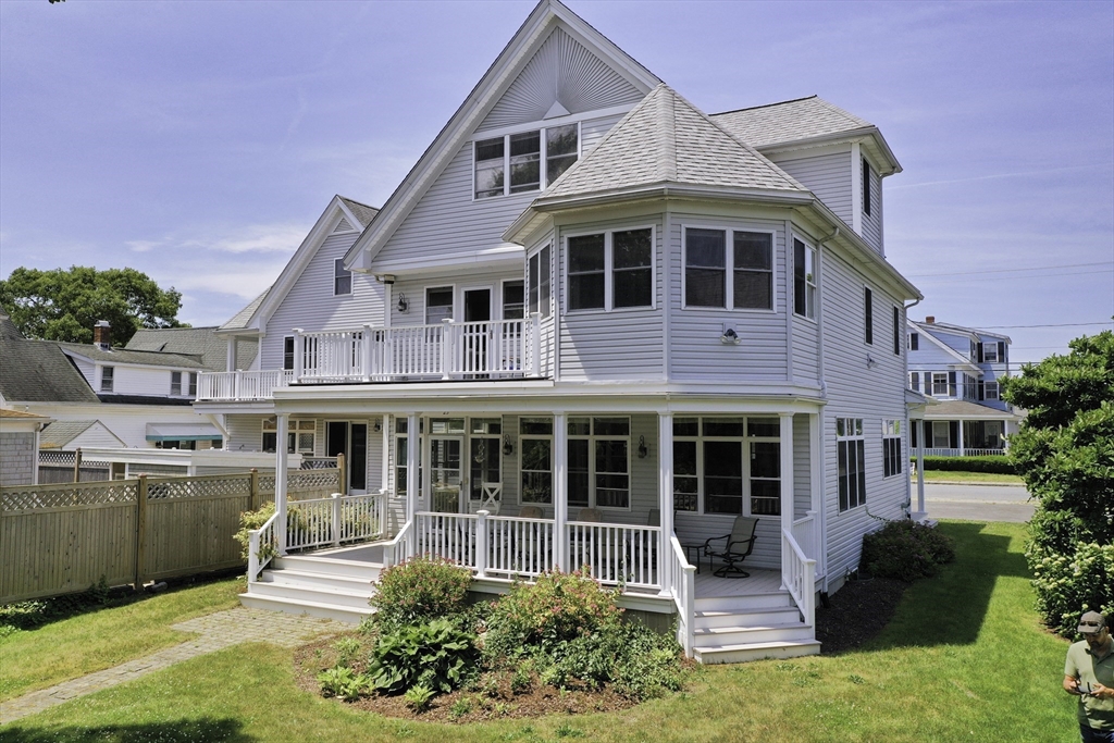 a front view of a house with a yard table and chairs