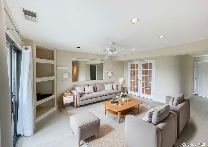 a living room with furniture and a window