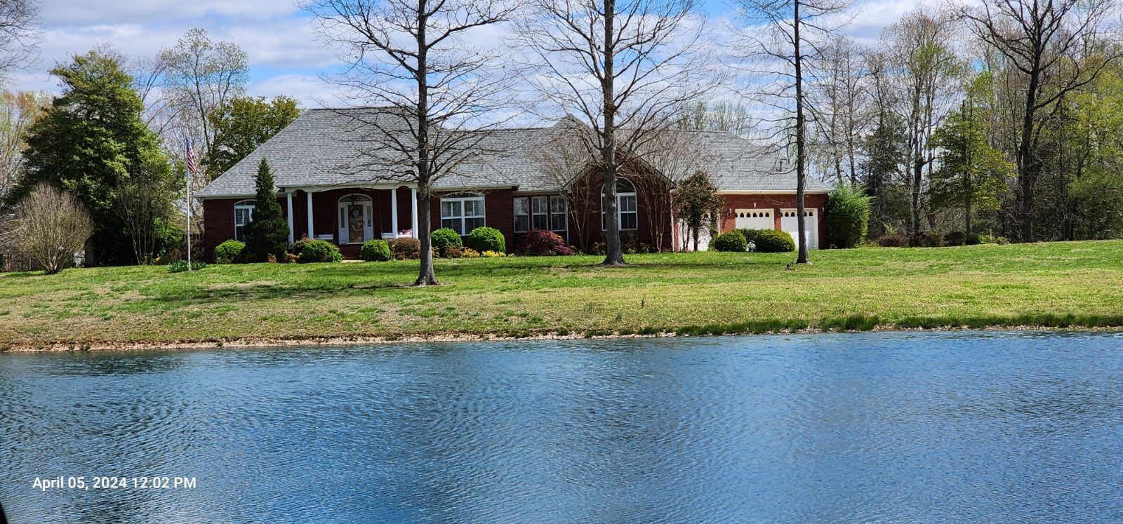 a house with a garden and trees