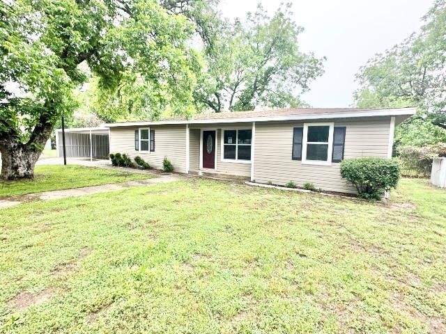 front view of a house with a yard