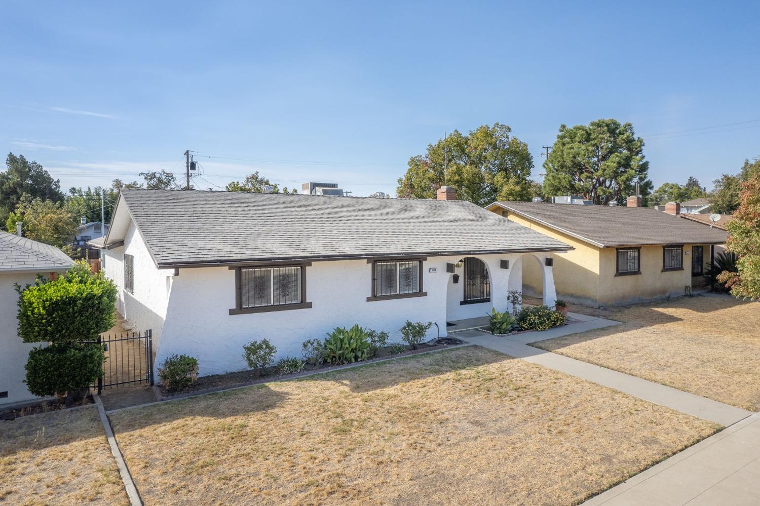 front view of a house with a yard