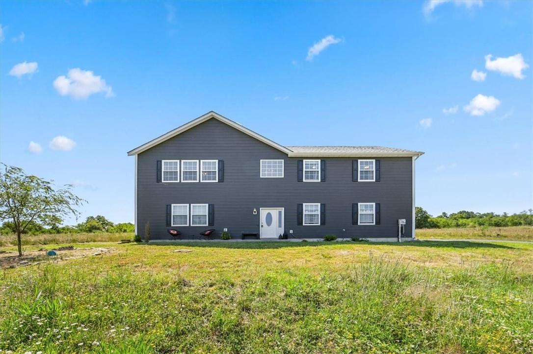 View of front of house with a front lawn