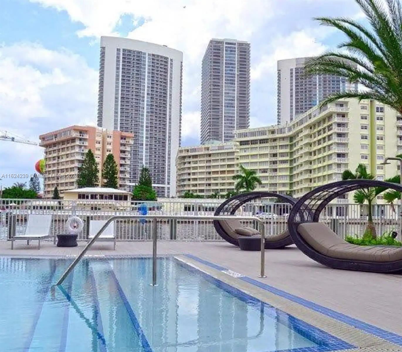 a view of a swimming pool with a lounge chairs