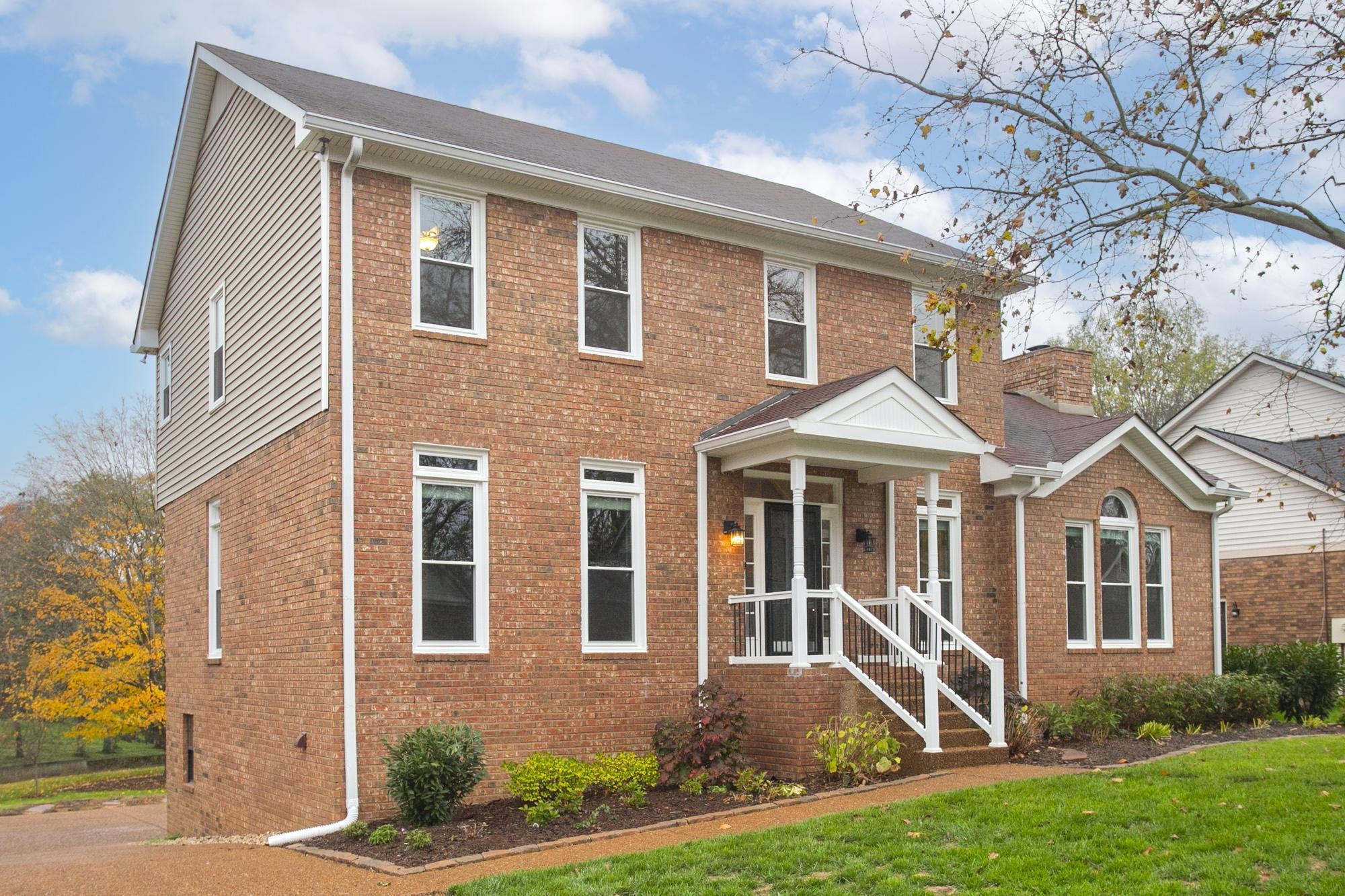 front view of a house with a yard