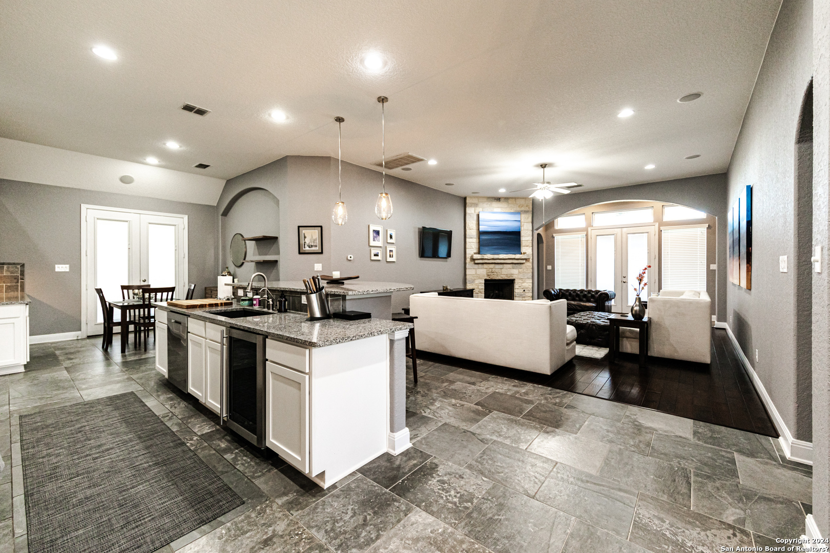 a large white kitchen with lots of counter space