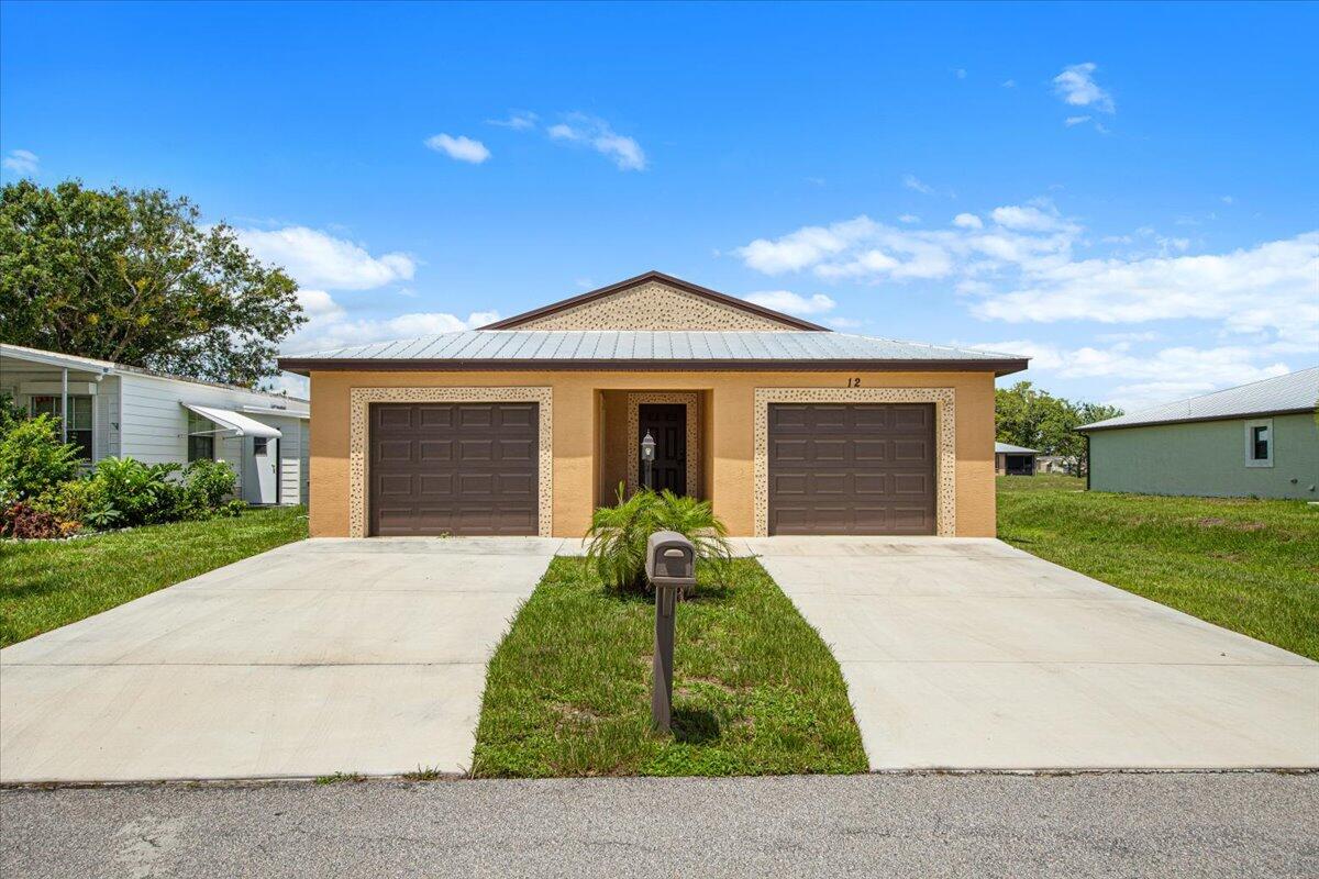 front view of a house with a yard