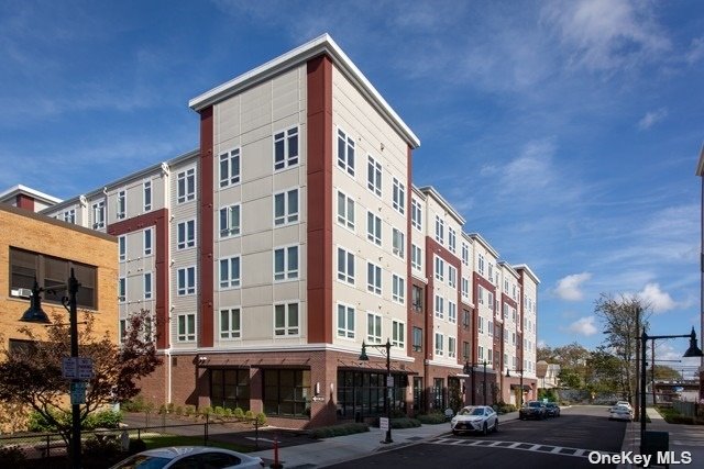 a front view of a building with street view