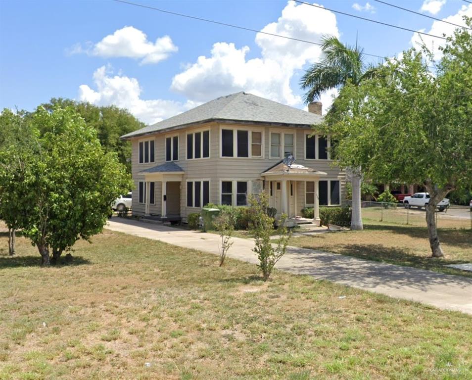 Colonial inspired home with a front lawn