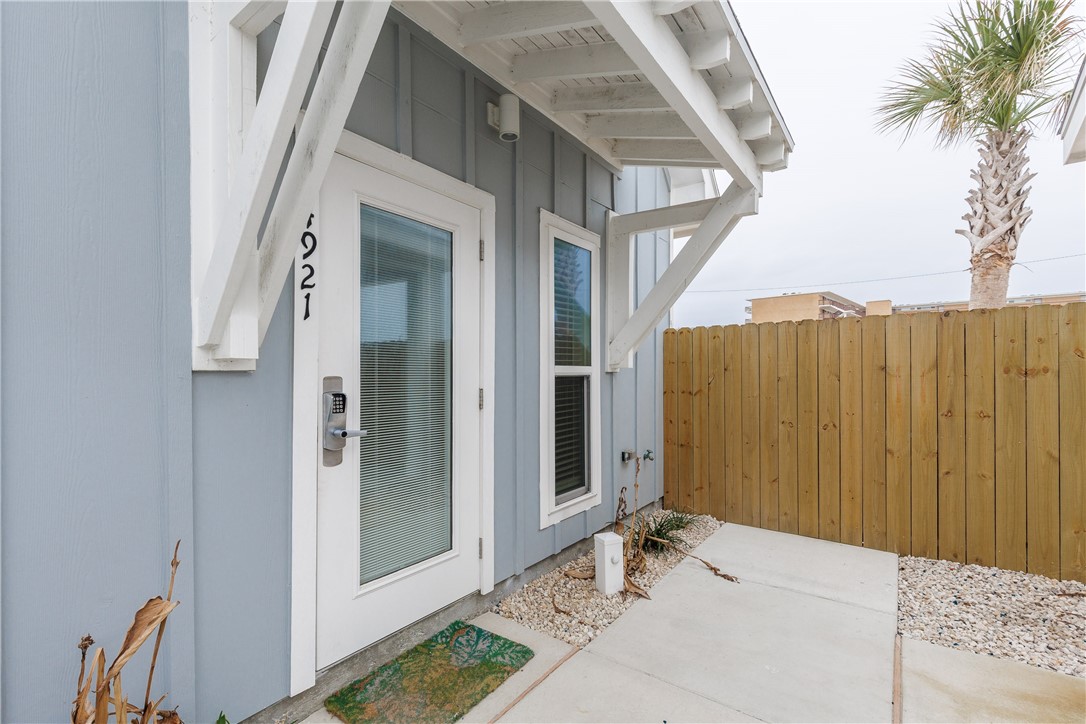 a view of a front door and wooden door