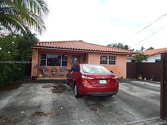 a front view of a house with parking space