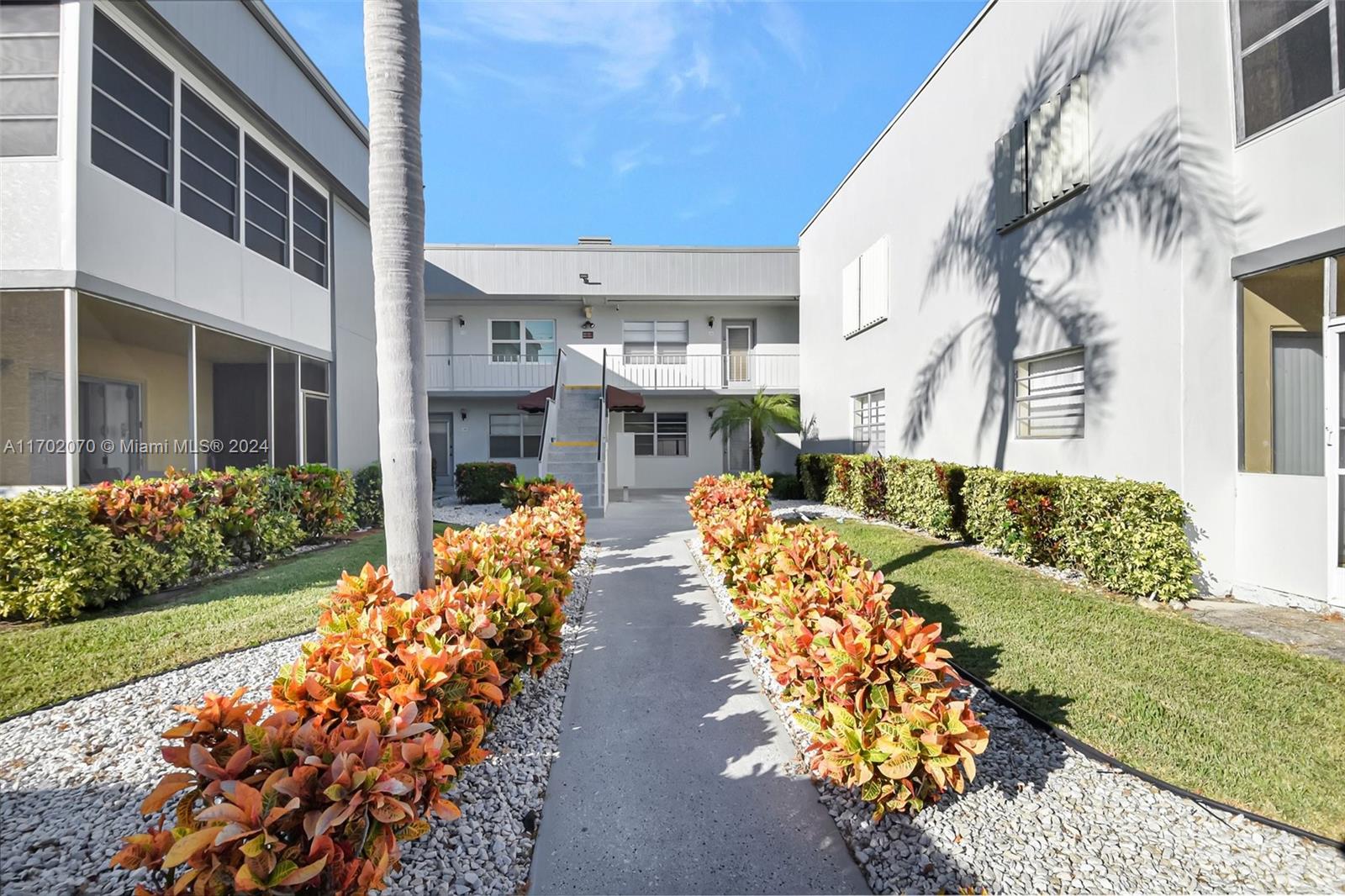 a front view of a building with an outdoor space