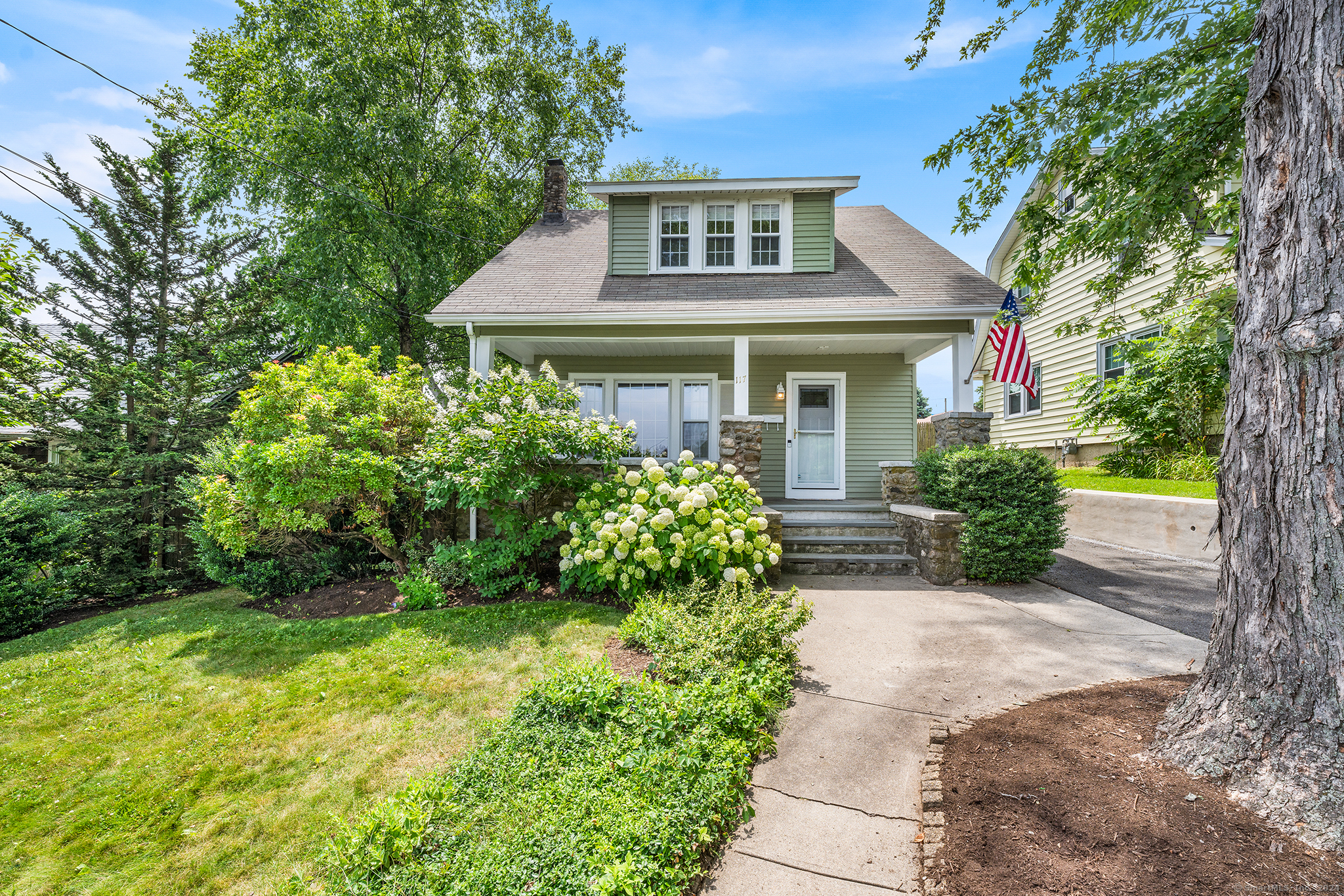 front view of a house with a yard