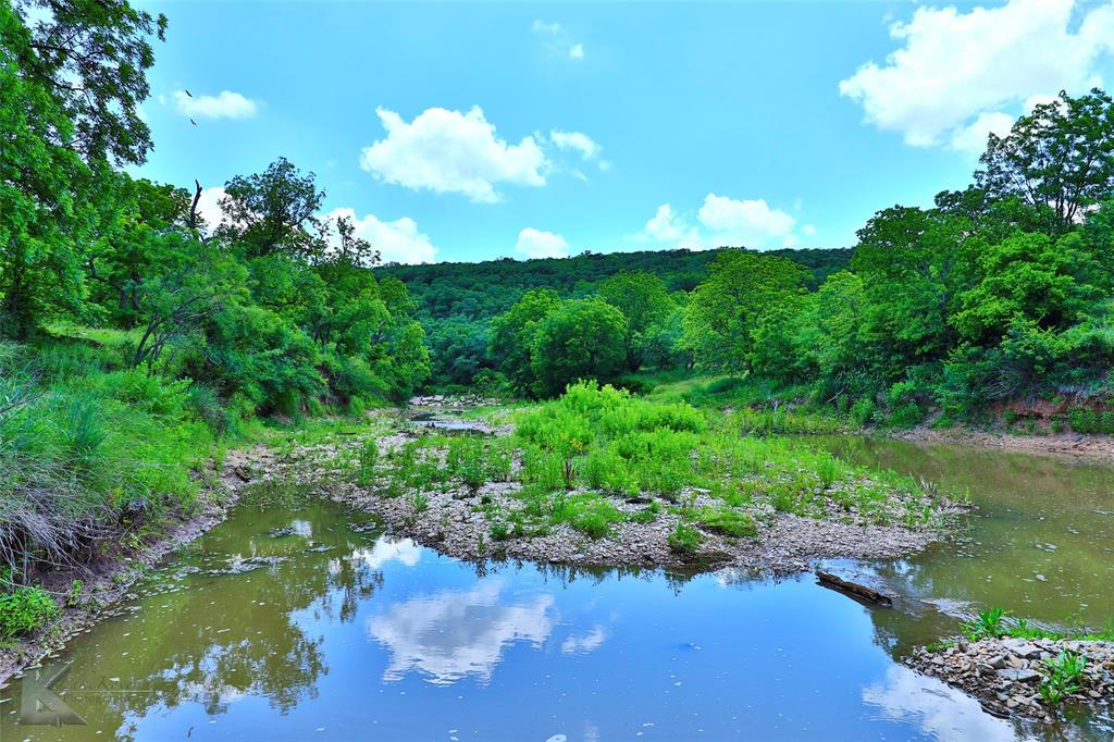 a view of a lake with a yard