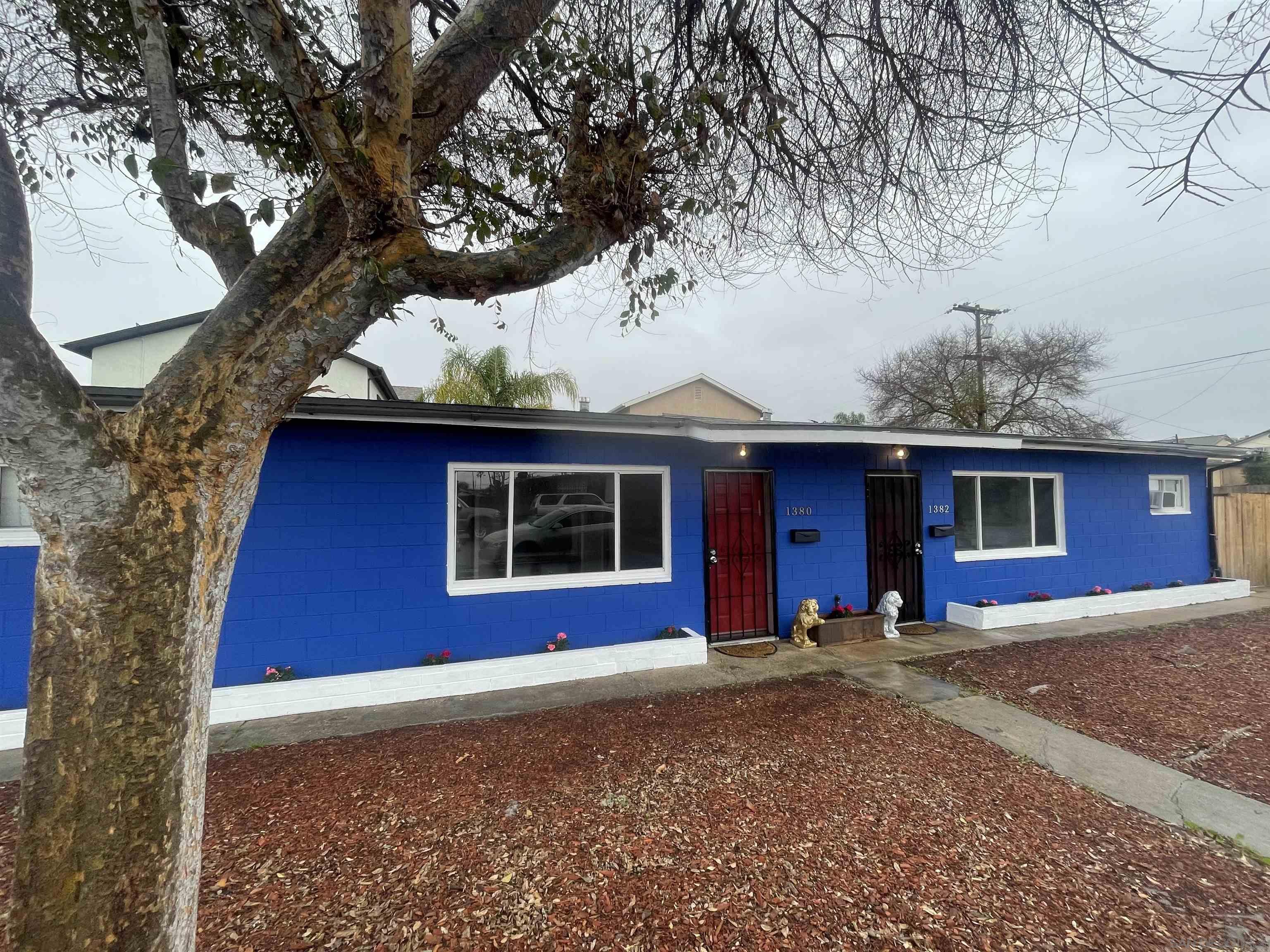 a house with trees in the background