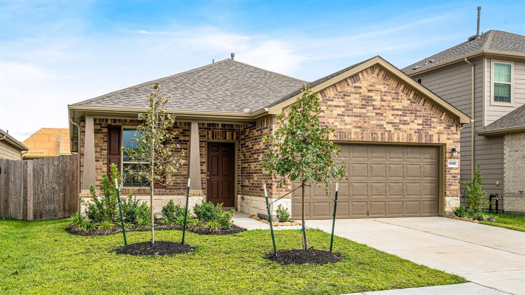 front view of a house with a yard