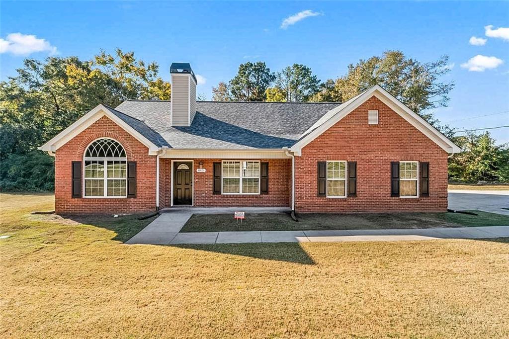 a front view of a house with a yard