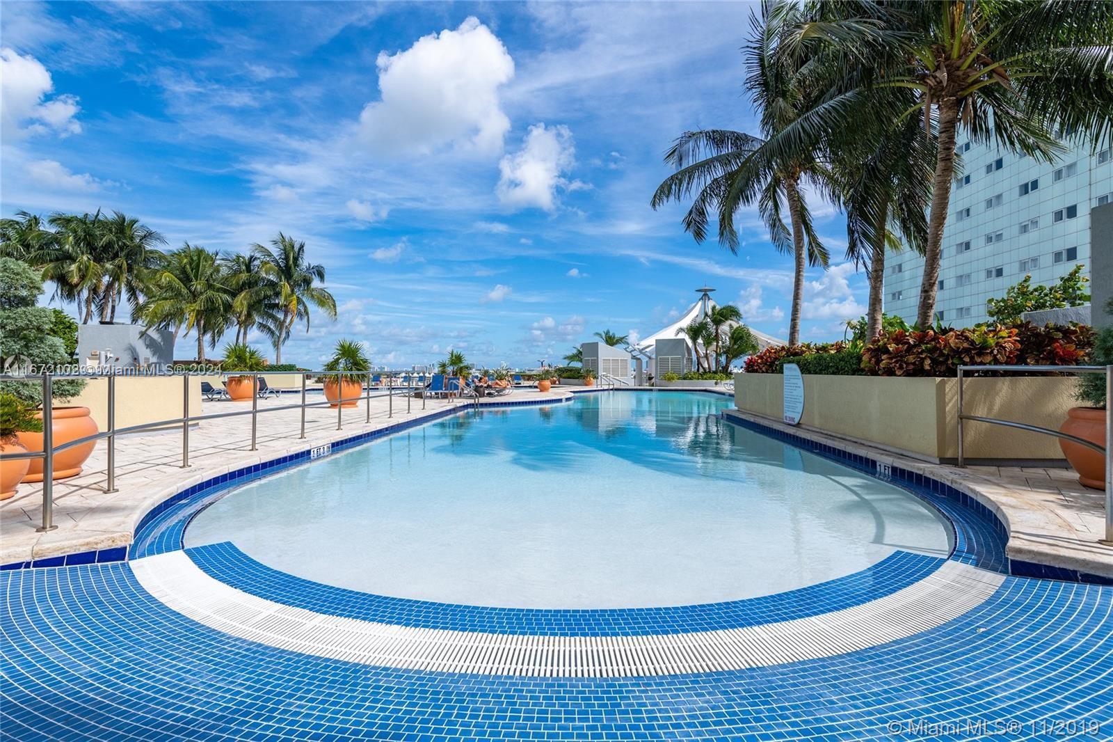 a view of a swimming pool with lounge chair