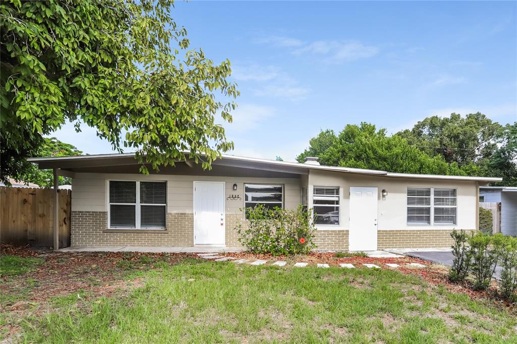 front view of a house with a yard