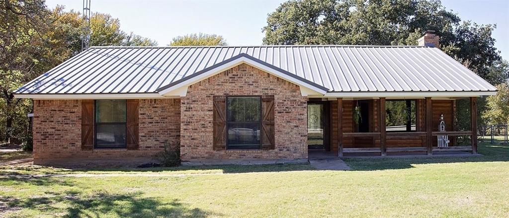 a view of a house with porch and sitting area