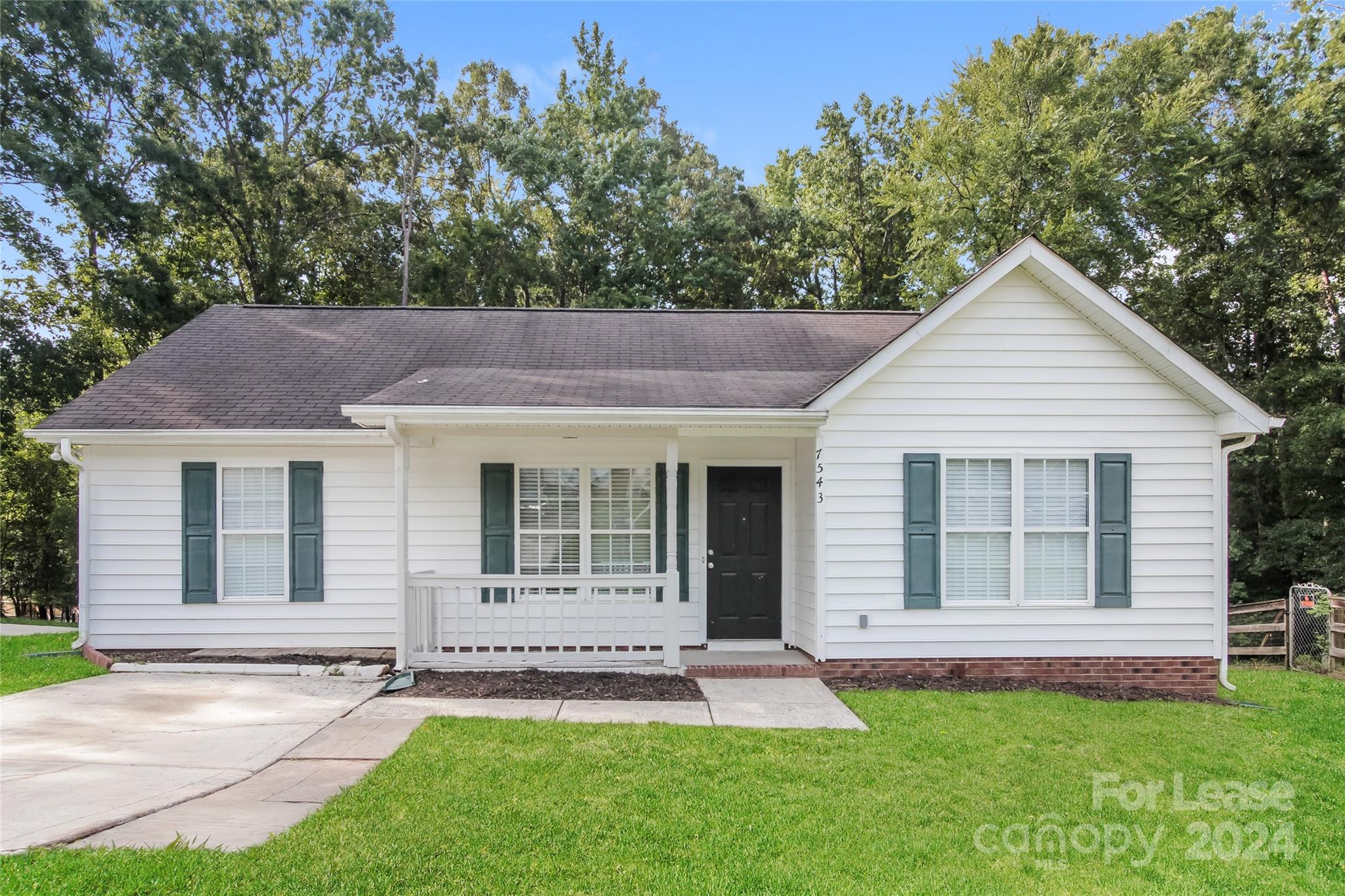 front view of a house with a yard