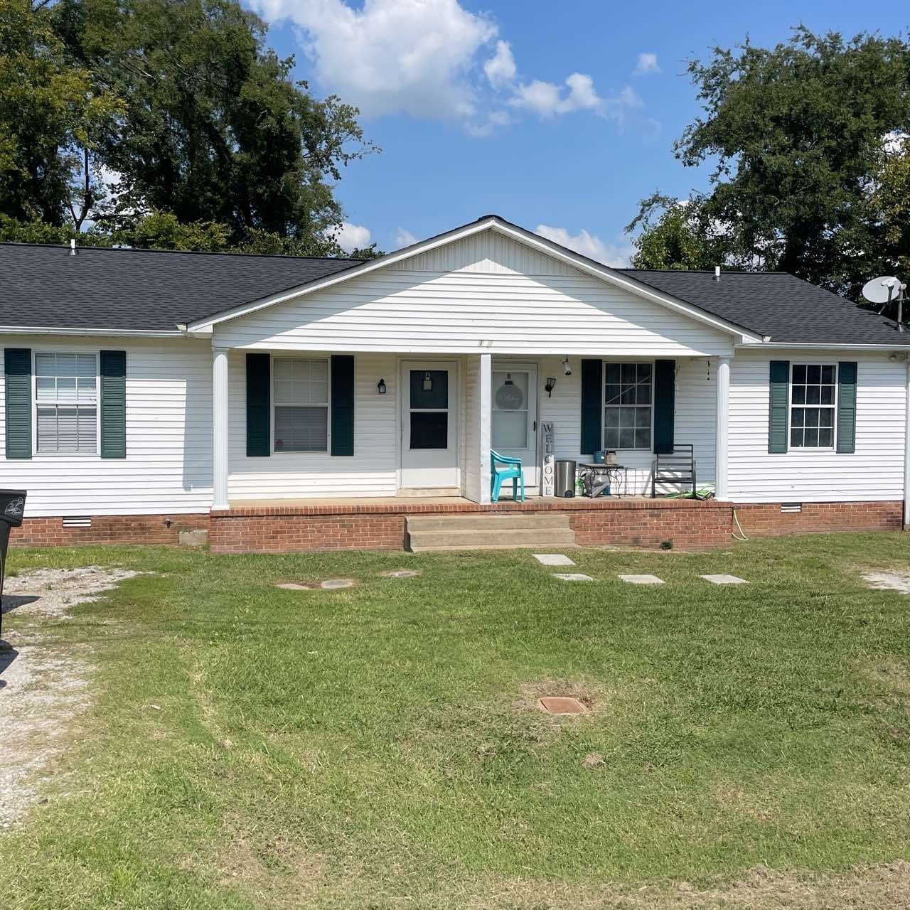 a front view of a house with a yard