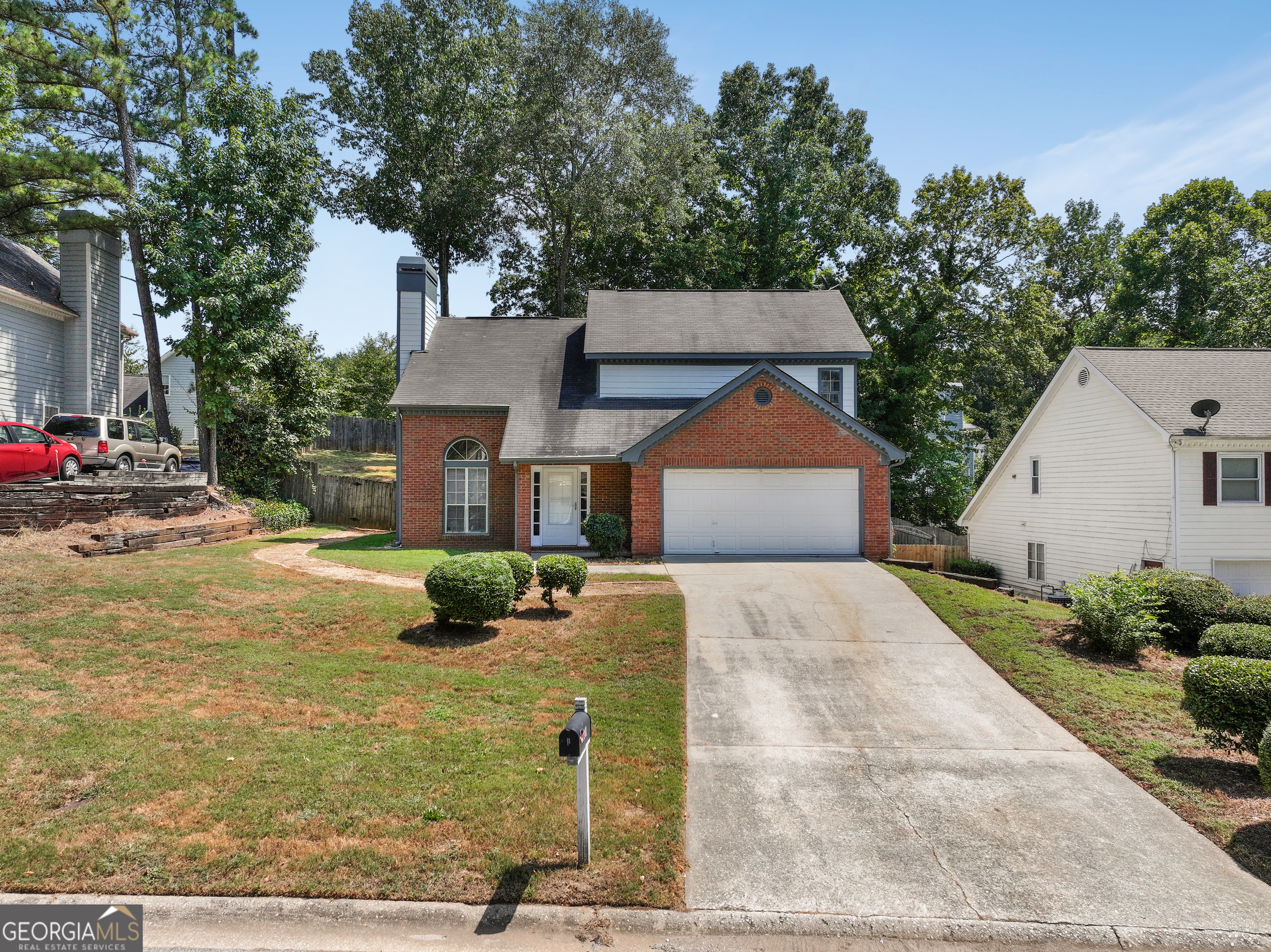 a front view of a house with yard