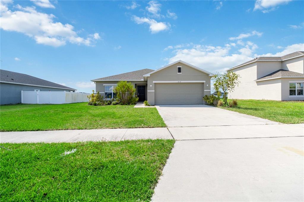 a view of a front of house with a yard