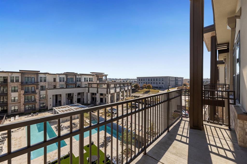 a view of a balcony with city view