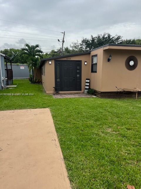 a view of a backyard with a garden and plants