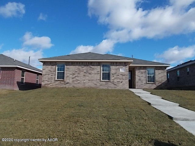 a front view of a house with yard