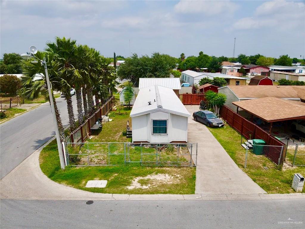 an aerial view of a house with outdoor space