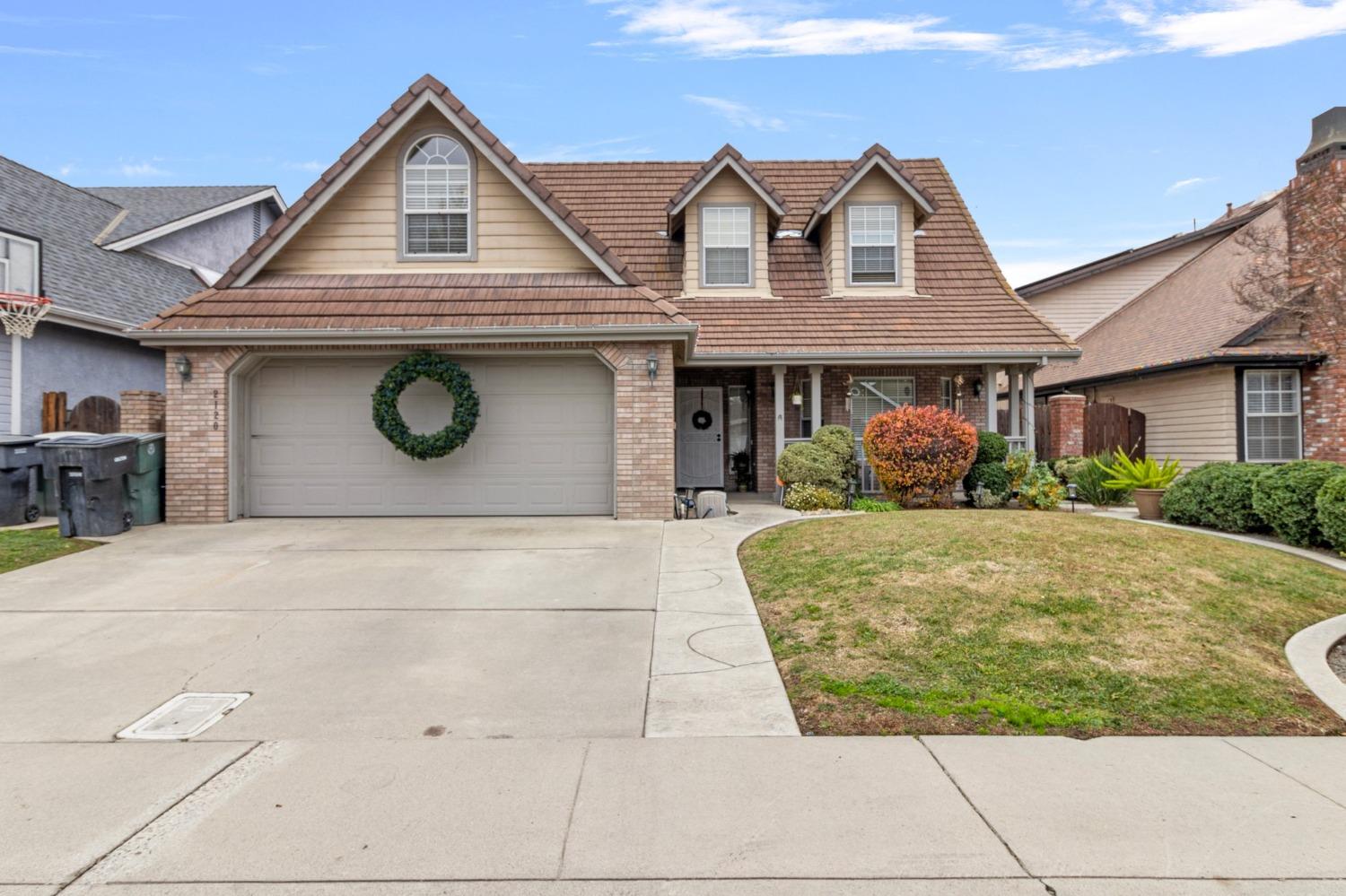 Great curb appeal with brick and siding front.  Tile roof.