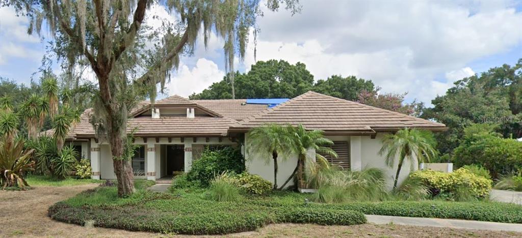 a view of a house with a garden