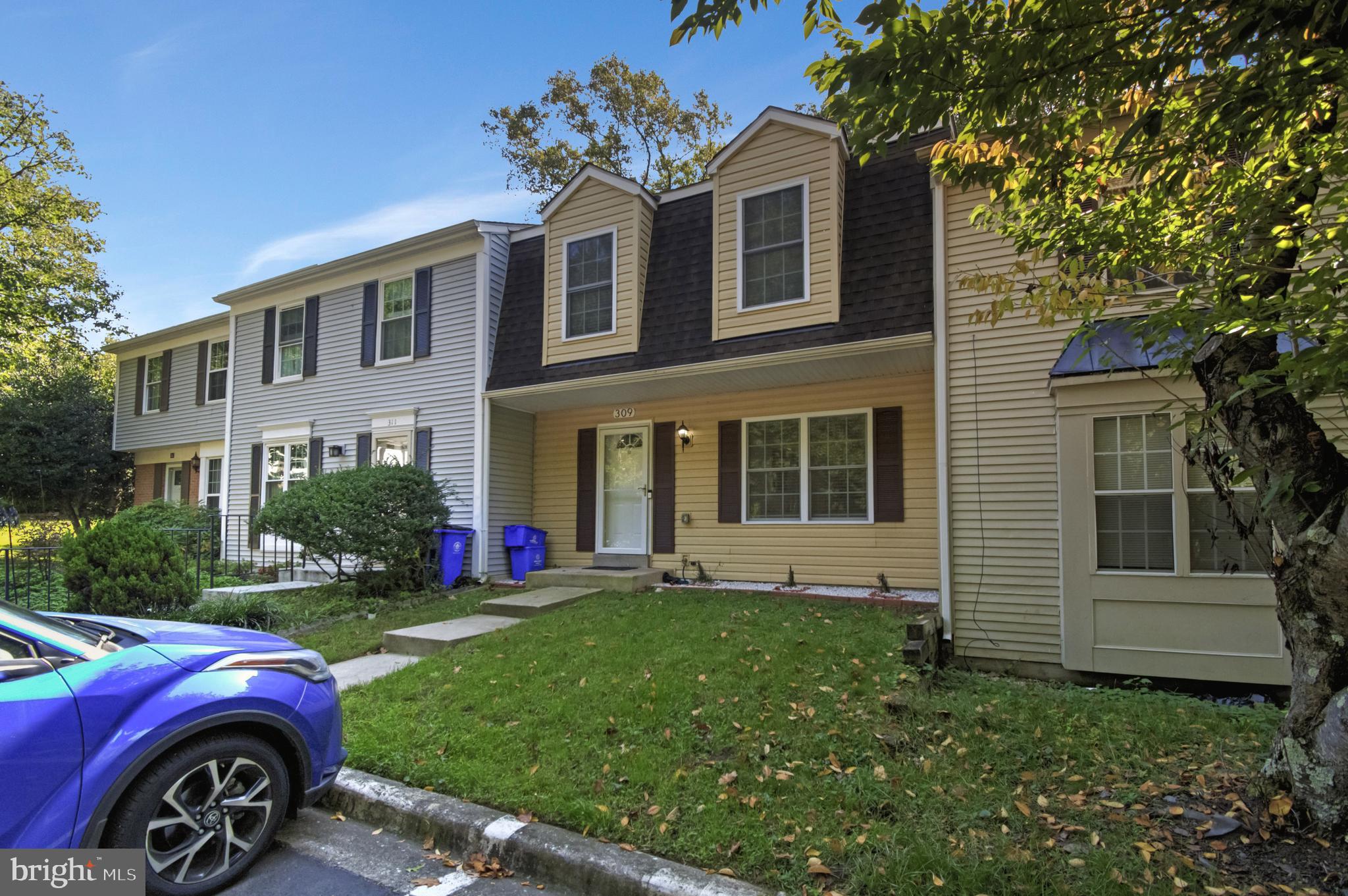 a front view of a house with a yard