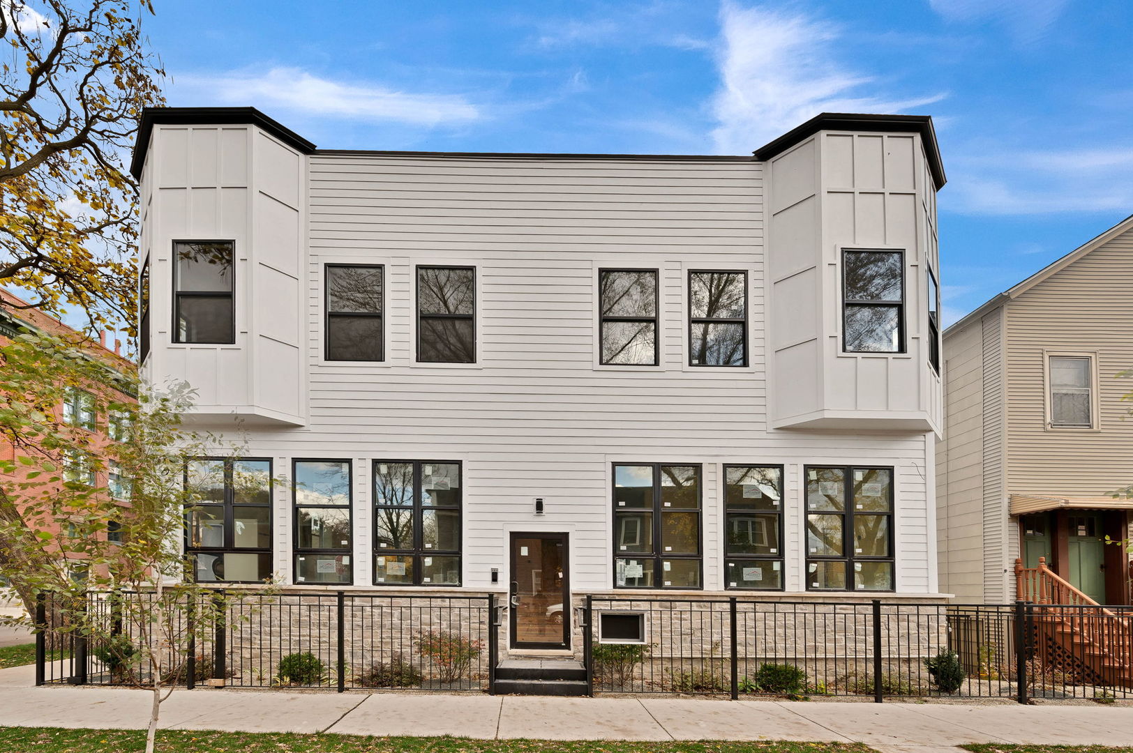 a front view of a building with glass windows