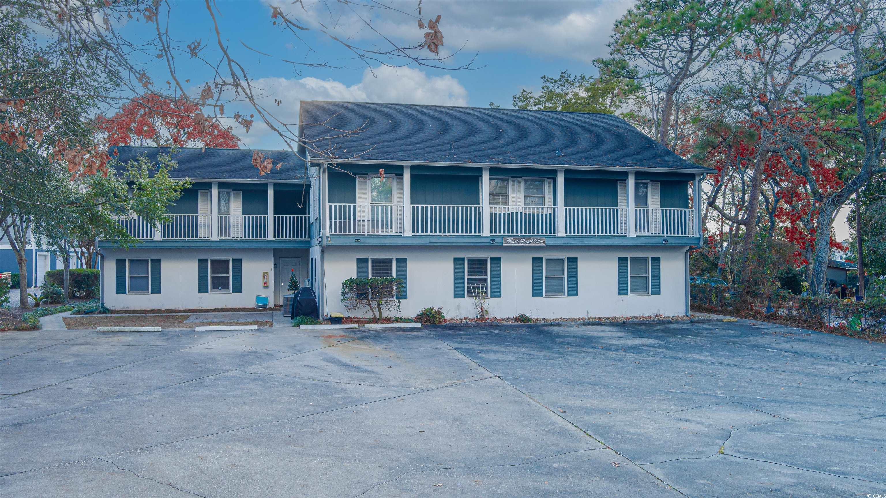 View of front property with a balcony