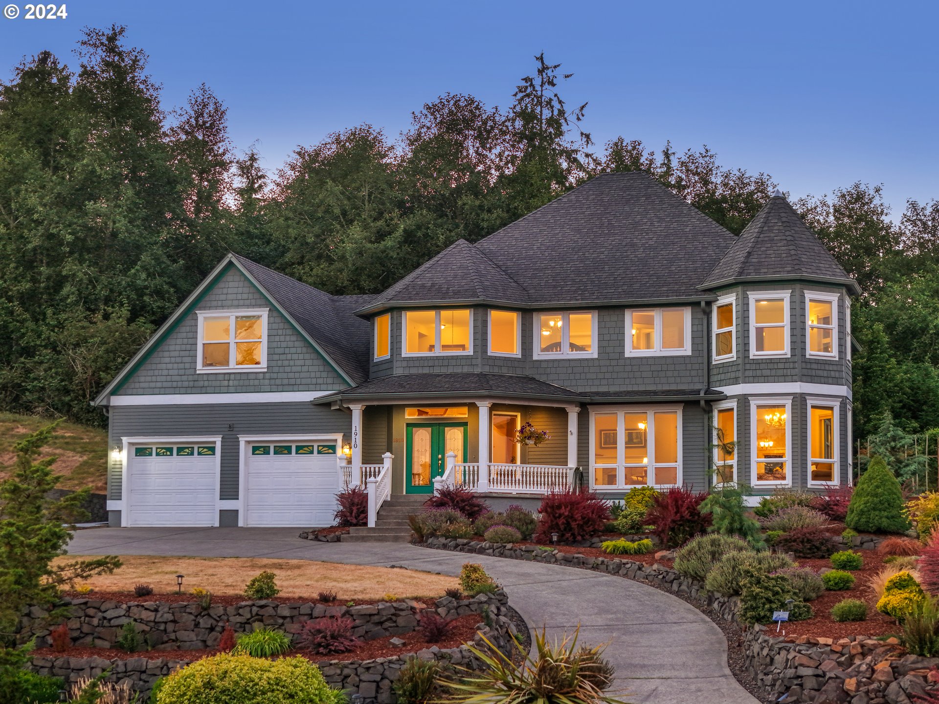 a front view of a house with garden