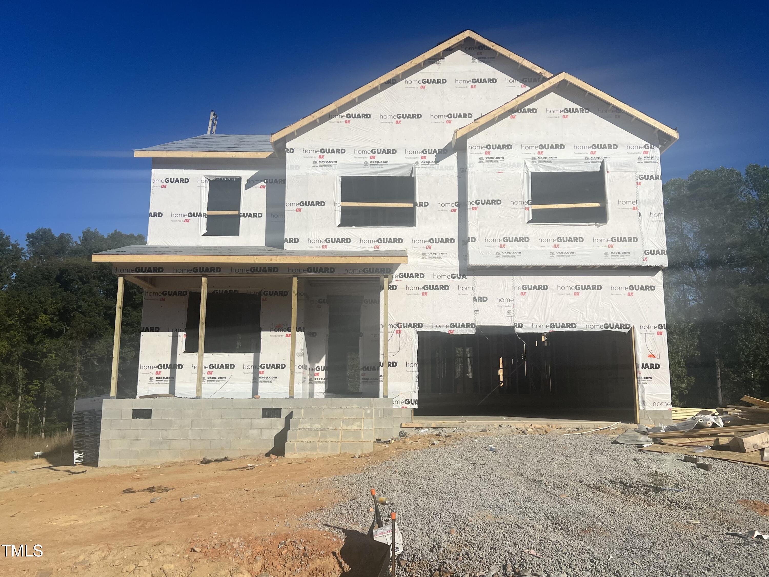 a front view of a house with a garage