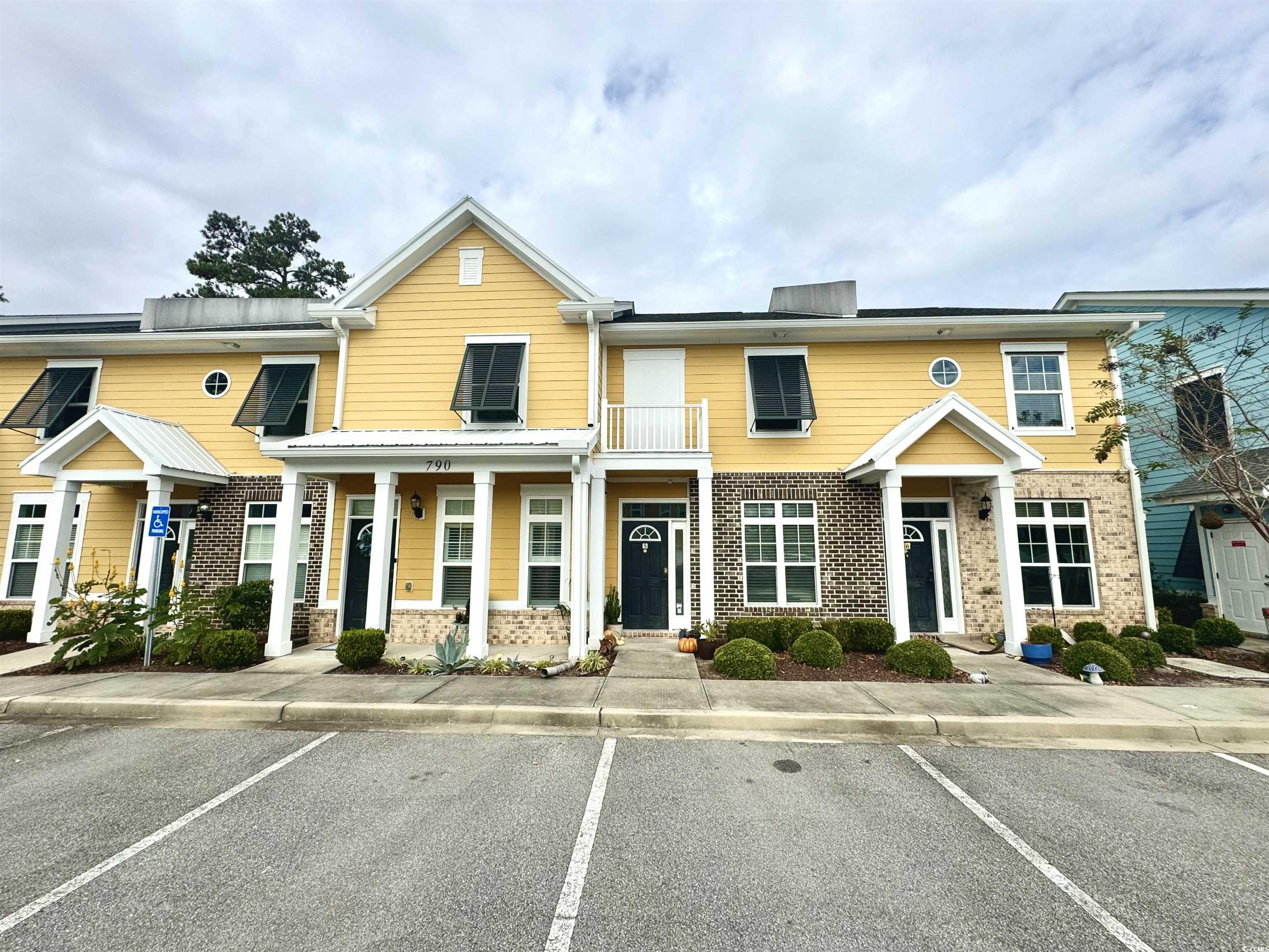 Multi unit property featuring a balcony