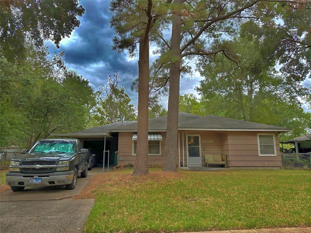 front view of a house with a garden