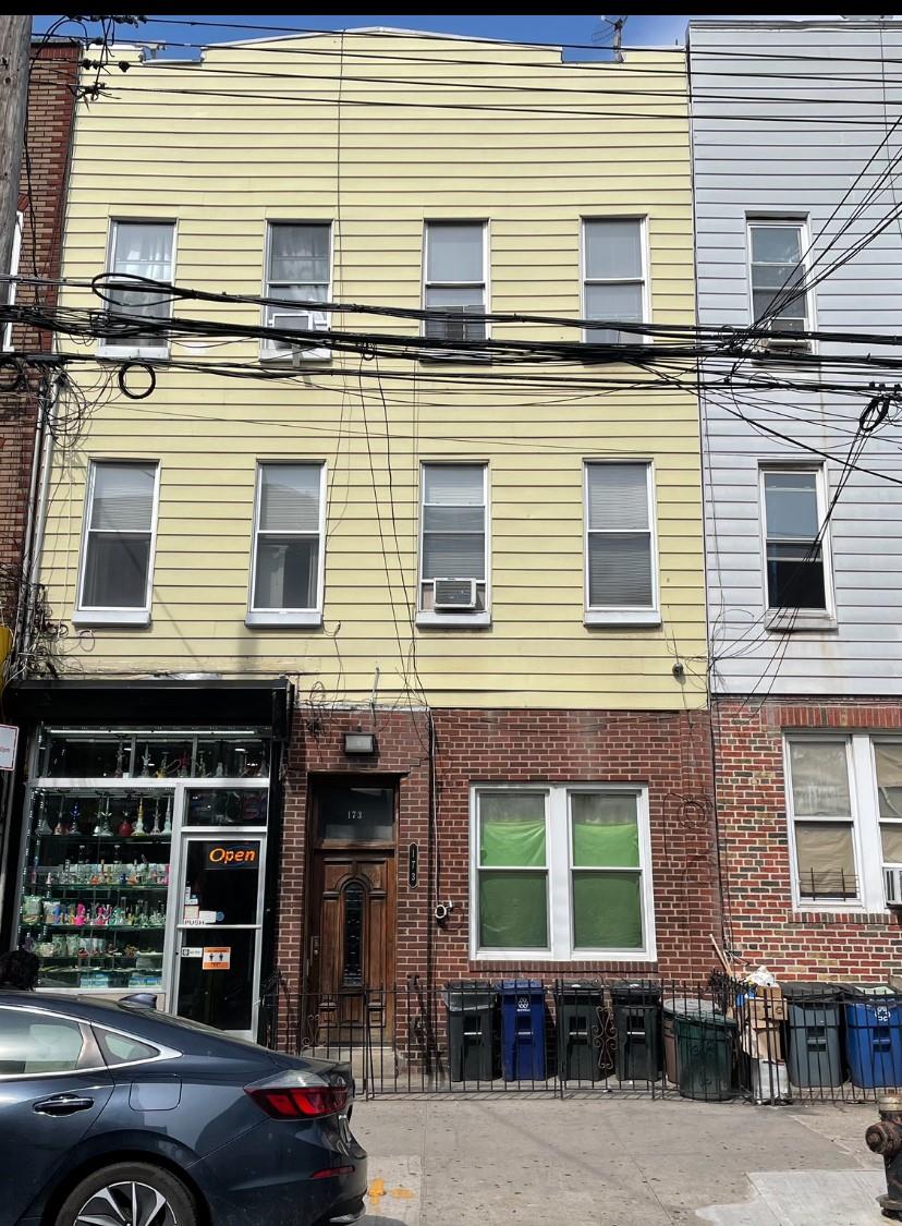 a view of a building with car parked