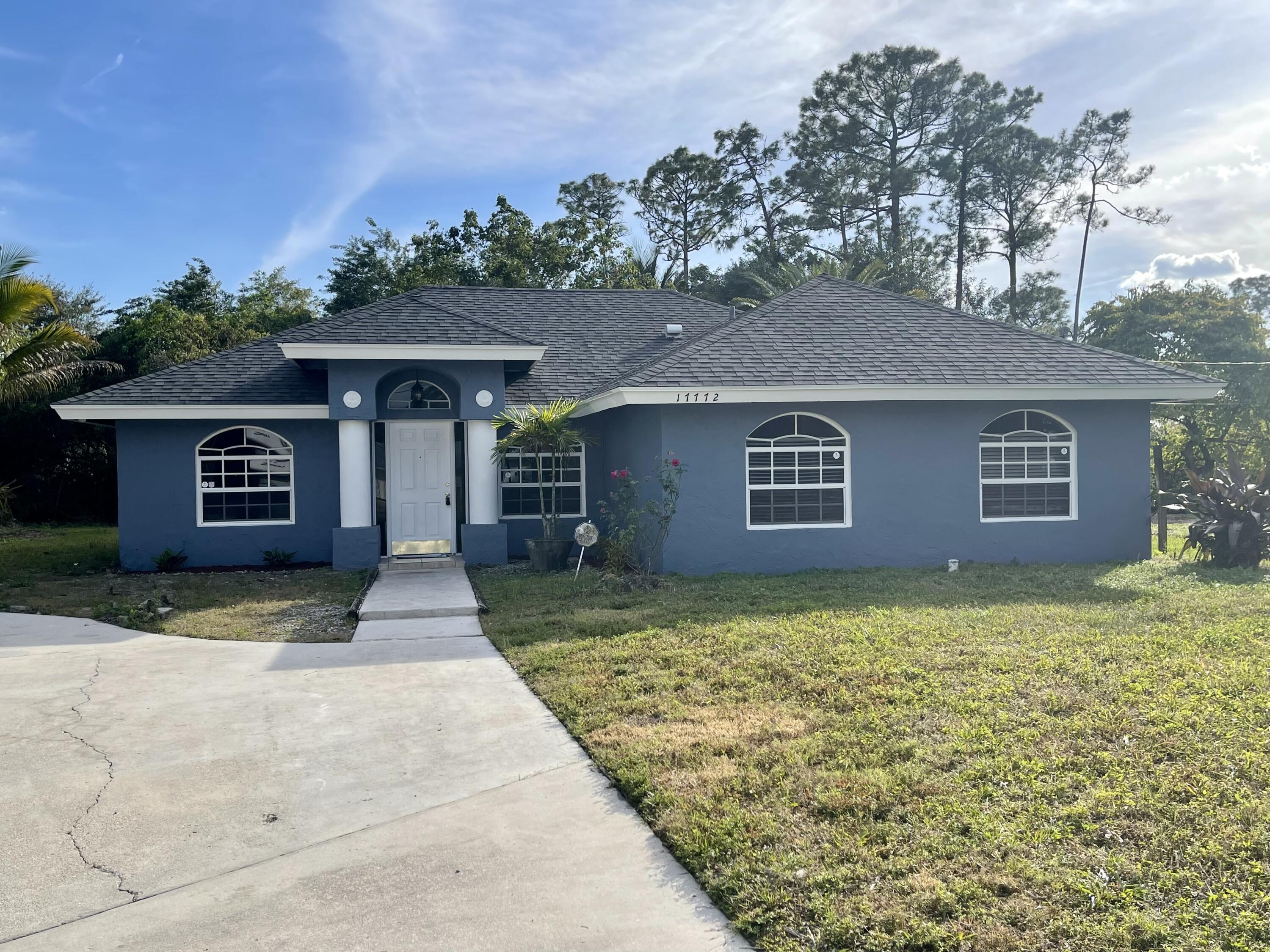 front view of a house with a yard