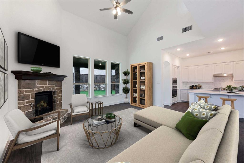 a living room with furniture fireplace and flat screen tv