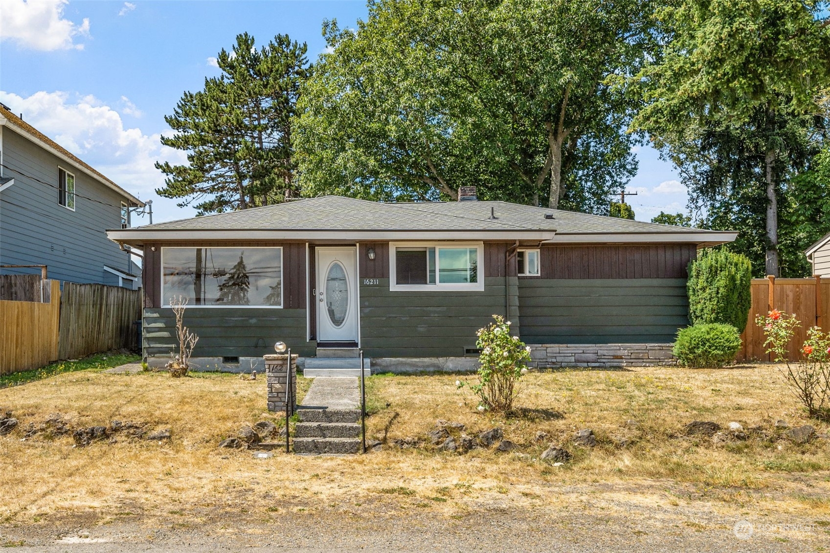 front view of a house with a yard