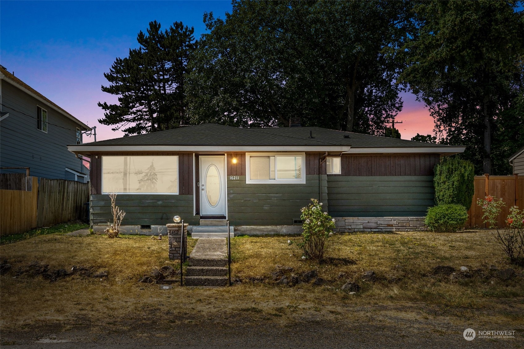 front view of a house with a yard